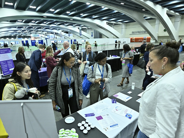 ACSM attendees browsing employers at the career fair.