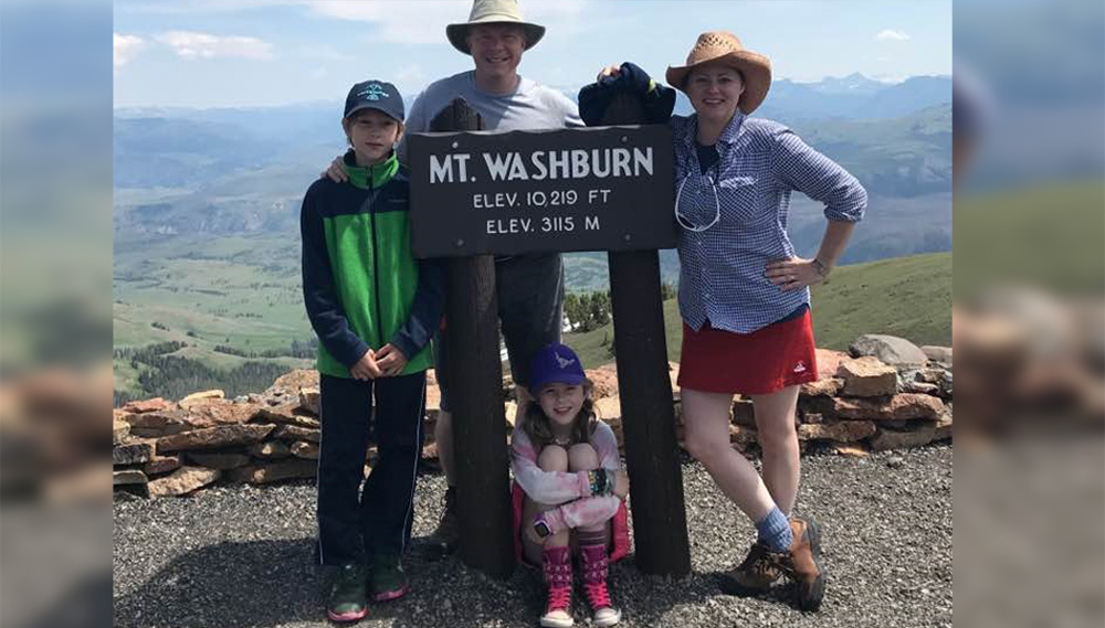 Dr. Petruska and her children and husband pose on a family hike.