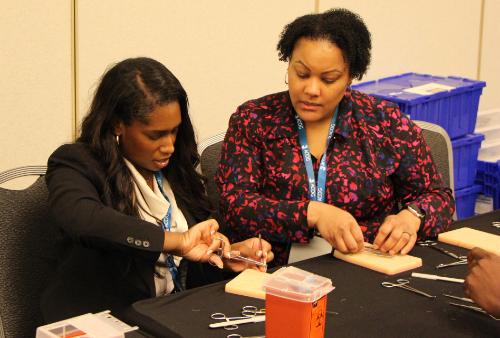 Two ACOG Members working at table