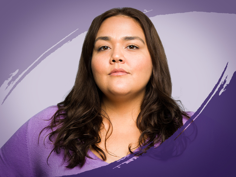 A woman with dark brown hair looking at the camera.