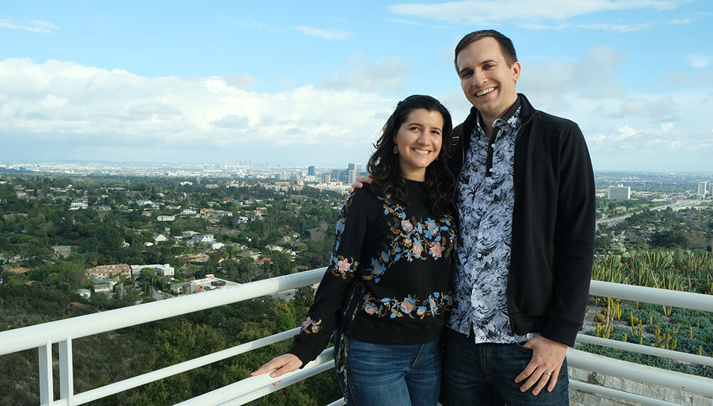 Natalia and her husband, smiling for the camera.
