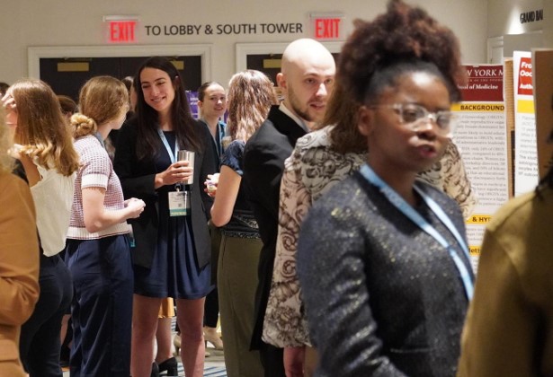 A group of District II members networking in a conference setting