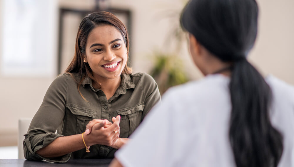 Patient and doctor talking.