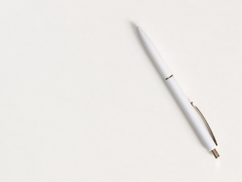white ballpoint pen on white background