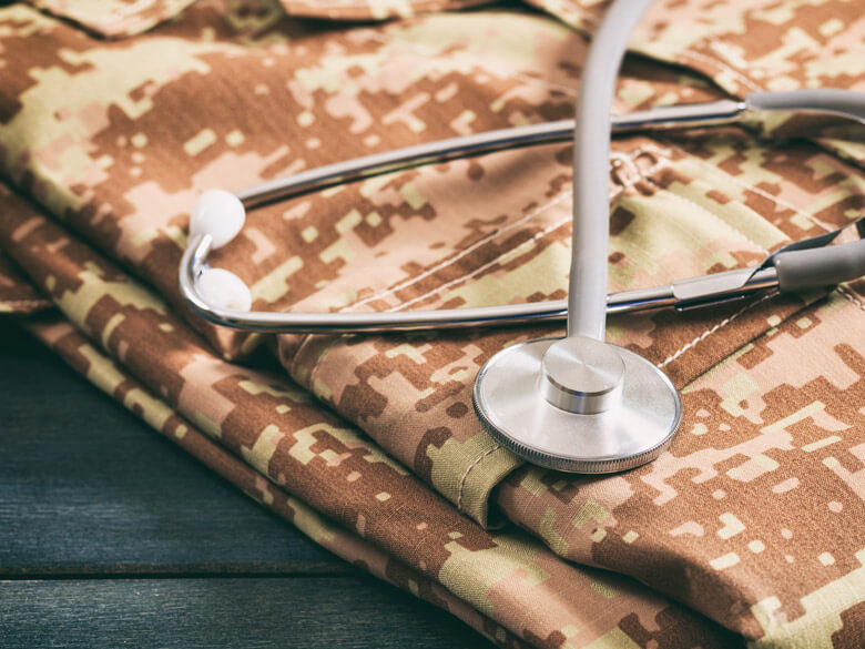 stethoscope on folded military uniform