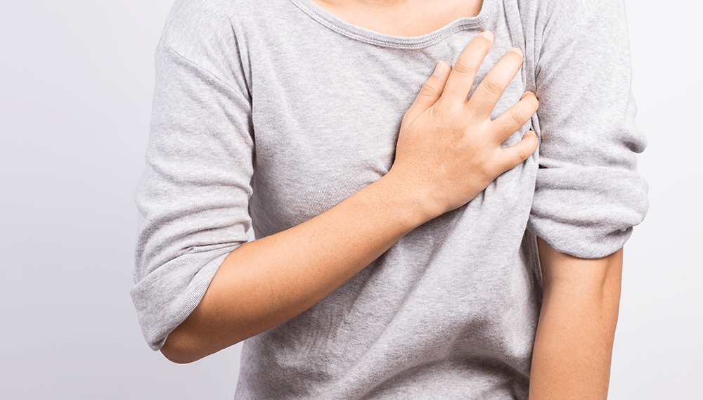 Patient holding chest.